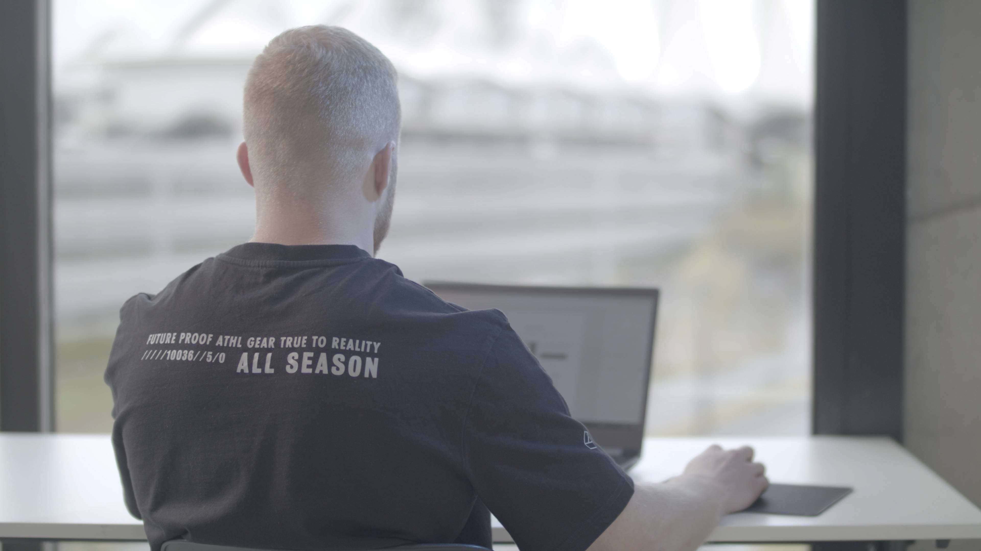 Karel Decoene smiling at Upthrust office in Antwerp